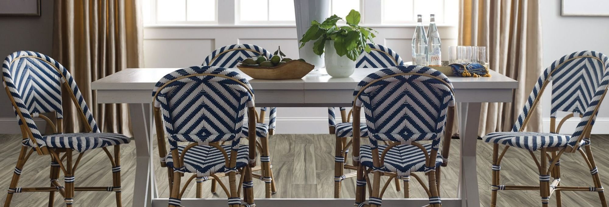 Table with chairs on the laminate floor provided by The Carpet Shop - Inspired Floors for Less in Benton Harbor, MI