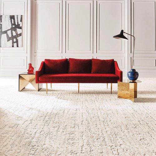 Red sofa on the nylon carpet floor from The Carpet Shop - Inspired Floors for Less in Benton Harbor, MI