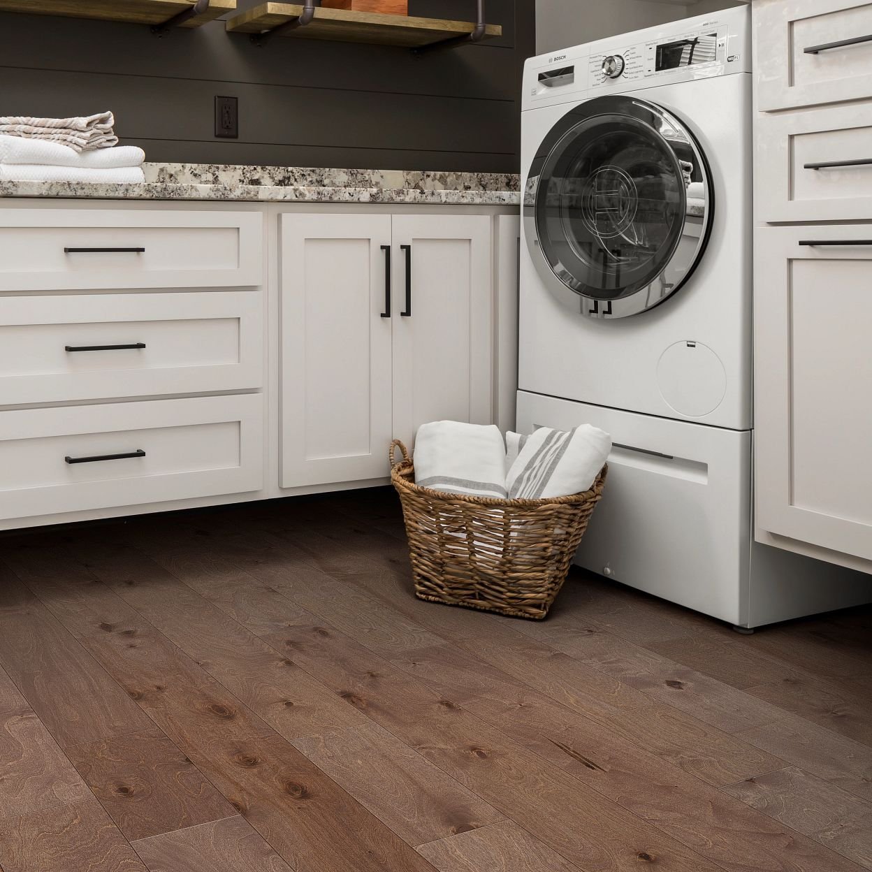 white bathroom cabinets on a brown hardwood floor from The Carpet Shop - Inspired Floors for Less in Benton Harbor, MI