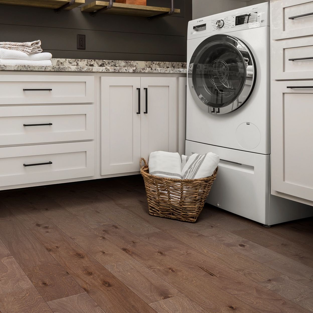 white bathroom cabinets on a brown hardwood floor from The Carpet Shop - Inspired Floors for Less in Benton Harbor, MI